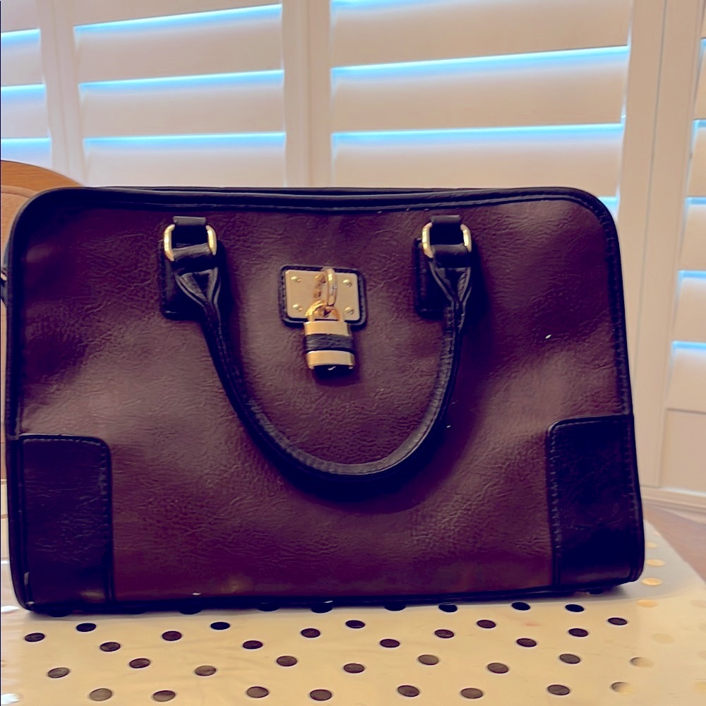 Elegant Brown and Black Womans bag with large gold lock